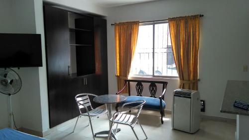 Zona de estar de Arco Apartasuites