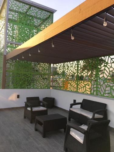 Herbal Inn Suitesにあるシーティングエリア