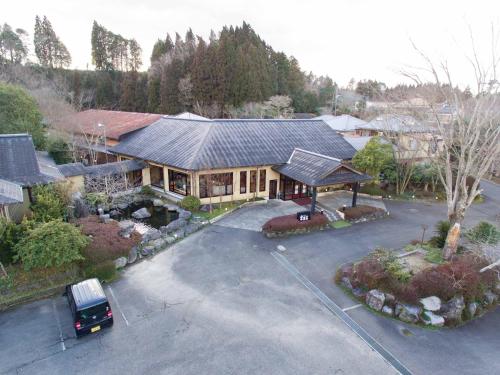 an aerial view of a house with a parking lot at Tokiwaso in Miyakonozyō