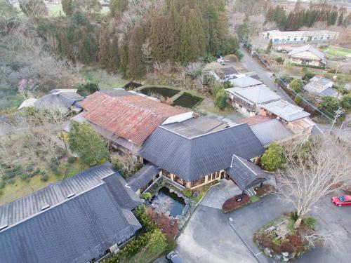 an aerial view of a house with many roofs at Tokiwaso in Miyakonozyō