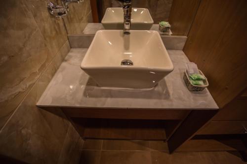 a sink in a bathroom with two sinks at El Mariscal Cusco in Cusco