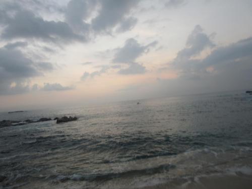 a view of the ocean under a cloudy sky at Sanderling Silent Beach Cabanas in Tangalle