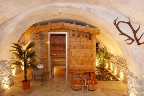 a small room with an archway in a building at Hotel Crusch Alba Sta Maria in Sta Maria Val Müstair