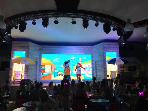 a crowd of people watching a show on a stage at Turlin Valley in Poole