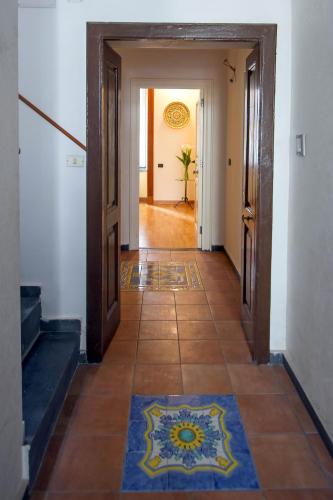 a hallway with two doors and a tile floor at Panorama Host - Casa Vela in Maiori