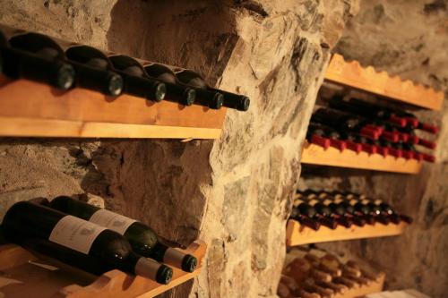 a bunch of bottles of wine in a wine cellar at Hotel Reiterhof in Wirsberg