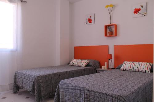 Postel nebo postele na pokoji v ubytování Apartamento Promar