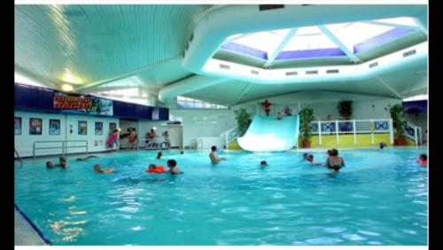 a group of people in a swimming pool at Turlin Valley in Poole