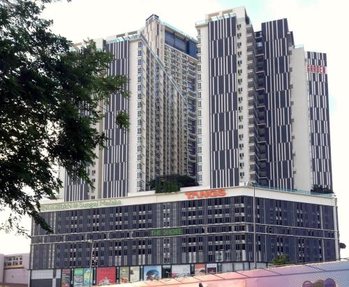 a group of tall buildings in a city at Relax & Chill at Malacca River in Melaka