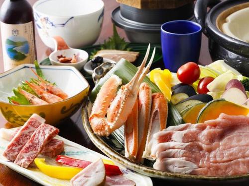 a table with a tray of different types of food at Terakoya Hanatei in Asago