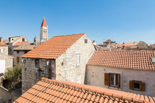 a group of buildings with orange tiled roofs at Apartment Patricia in Trogir