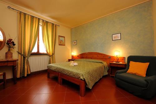 Postel nebo postele na pokoji v ubytování Boschetto del Lago