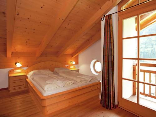 Chalet Chalets Im Wald 3にあるベッド