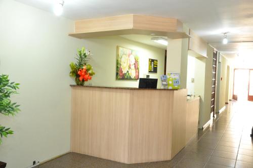 a lobby of a hospital with a reception counter at Klein Ville Esteio Centro in Esteio