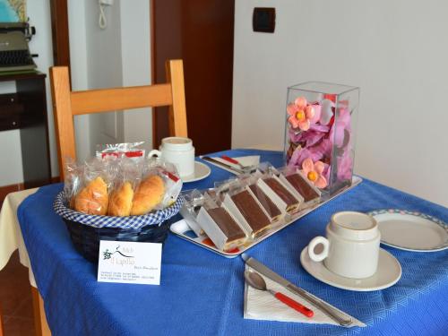 a table with a blue table cloth with food and a tray of food at Il Lapillo in Ercolano