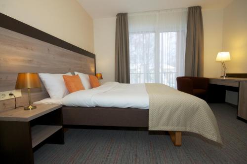 Una cama o camas en una habitación de Labas Rytas Vila