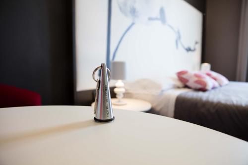 a faucet on a table in a hotel room at Hotel Vittorio in Desenzano del Garda