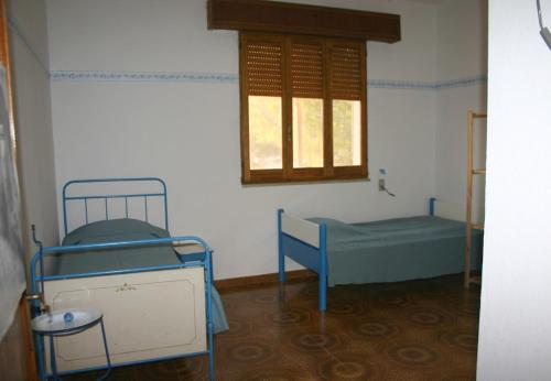 En eller flere senger på et rom på Casa Montani