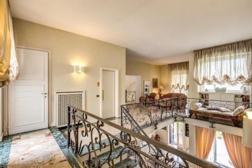 a living room with two spiral stairs in a house at La Gaura Guest House in Casal Palocco