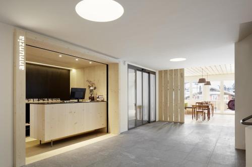a lobby with a reception desk in a building at Medelina in Curaglia