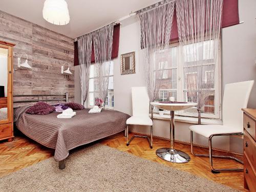 Posteľ alebo postele v izbe v ubytovaní Apartament Kameralny na Starówce