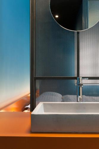 a bathroom with a sink and a mirror at Syntagma Square Modern Apartments in Athens