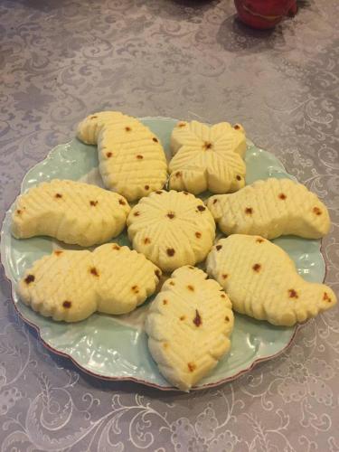 a plate of cookies on top of a table at Ancient Lahij Guest House in Lahıc