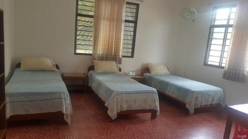 Un pat sau paturi într-o cameră la Hotel Orinoco Real
