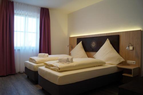 Voodi või voodid majutusasutuse Hotel Gasthaus Sonne toas