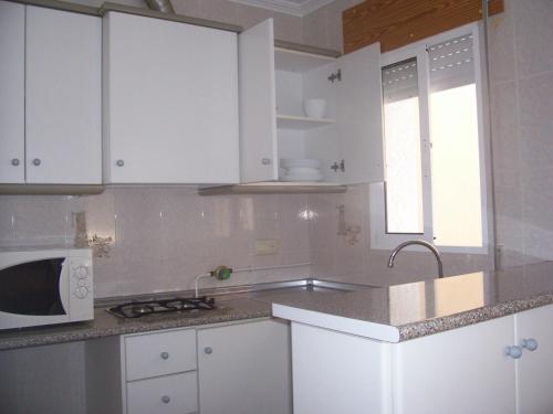 Kuchyň nebo kuchyňský kout v ubytování Apartamentos Berlin
