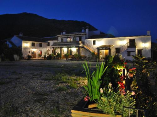 a large house at night with lights on at Belvilla by OYO Cortijo las Monjas in Periana