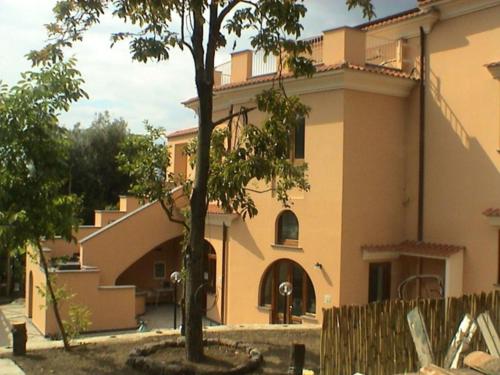 a house with a tree in front of it at Boutique Mansion in Sorrento with Picturesque View in Sorrento