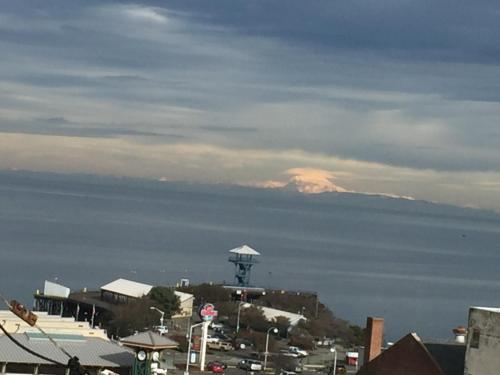 a view of a city with a mountain in the background at Port Angeles Inn in Port Angeles