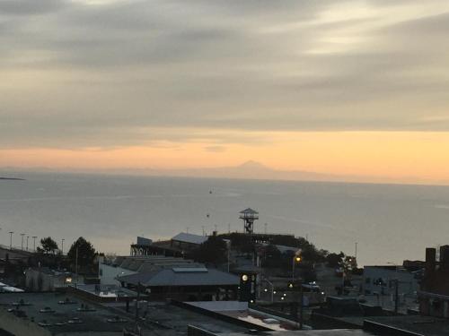 a view of a city with a mountain in the background at Port Angeles Inn in Port Angeles