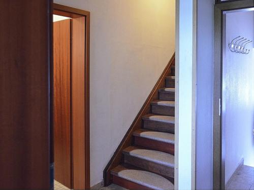 a stairway leading to a room with a door at Spacious Apartment in Niedersfeld near Lake in Winterberg