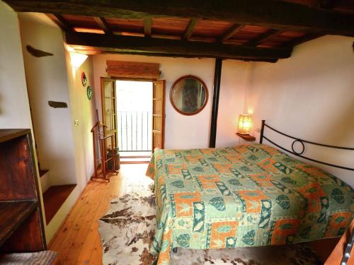 a bedroom with a bed in a room with a window at Beautiful Cottage in Pescia in San Quirico
