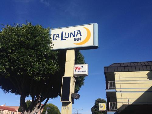 a sign for a la union inn in front of a building at La Luna Inn, an Ascend Collection Hotel in San Francisco