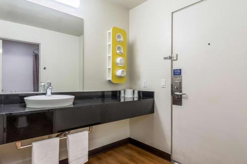 a bathroom with a sink and a mirror at Motel 6-Redlands, CA in Redlands