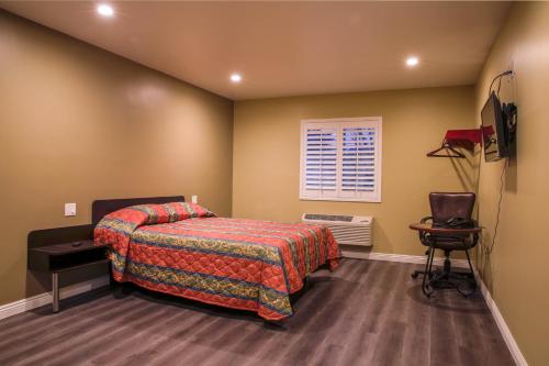 En eller flere senge i et værelse på Newport Bay Inn