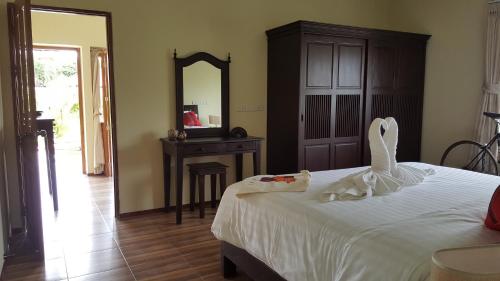 Postel nebo postele na pokoji v ubytování Taratai Villa Guest House