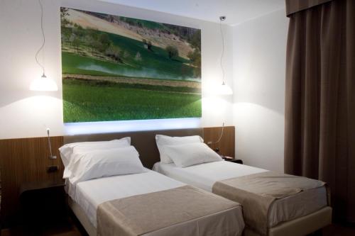 Una cama o camas en una habitación de HM MotelHotel