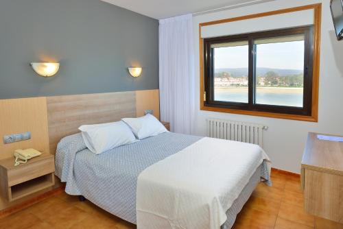 Ένα ή περισσότερα κρεβάτια σε δωμάτιο στο Hotel Montemar *** Superior