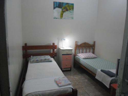 Ένα ή περισσότερα κρεβάτια σε δωμάτιο στο Hotel Palmas Tocantins