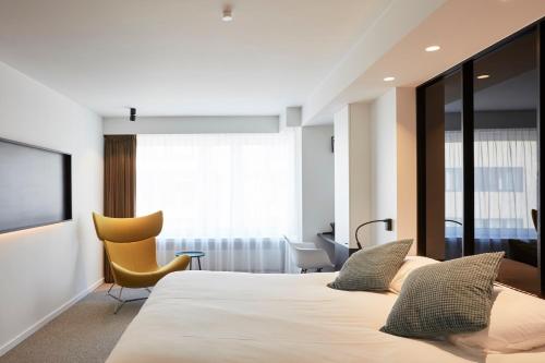 Postel nebo postele na pokoji v ubytování Hotel Nelson