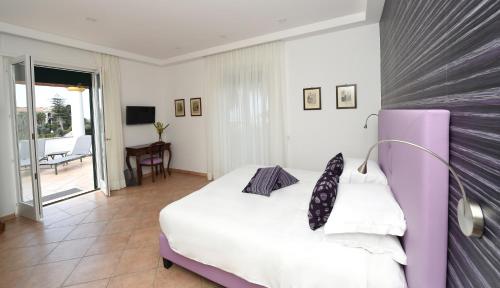Katil atau katil-katil dalam bilik di Bella Sorrento B&B
