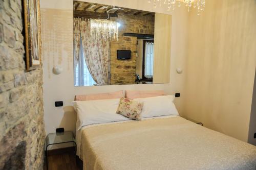 Postel nebo postele na pokoji v ubytování Suite Assisi