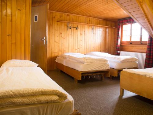 מיטה או מיטות בחדר ב-Plan-Francey