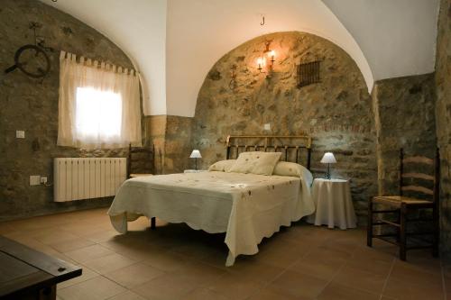 Postel nebo postele na pokoji v ubytování Apartamentos Rurales La Casa de Luis