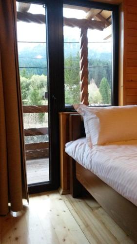 Postel nebo postele na pokoji v ubytování Taverna Ceahlau