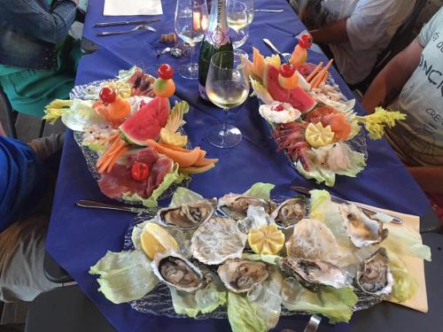 a blue table with a bunch of food on it at Hotel Lido in Follonica